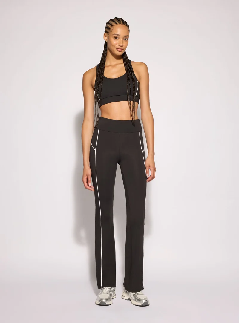 Leggings sportivi lunghi a zampa con piping