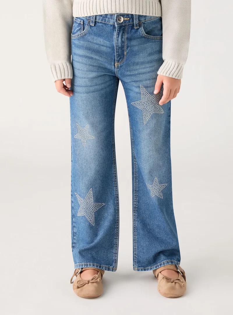 Jeans wide leg con stelle strass