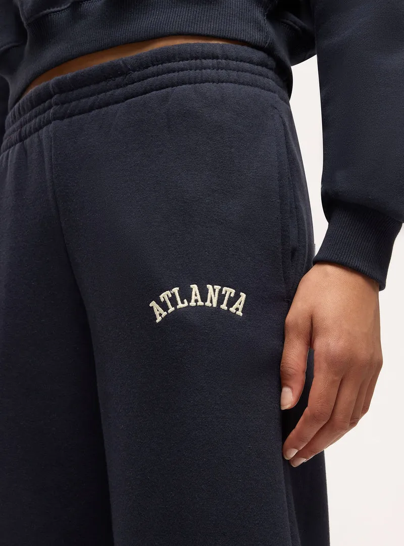 Pantaloni tuta vita alta con scritta college
