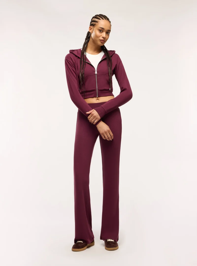 Leggings lunghi a zampa tinta unita