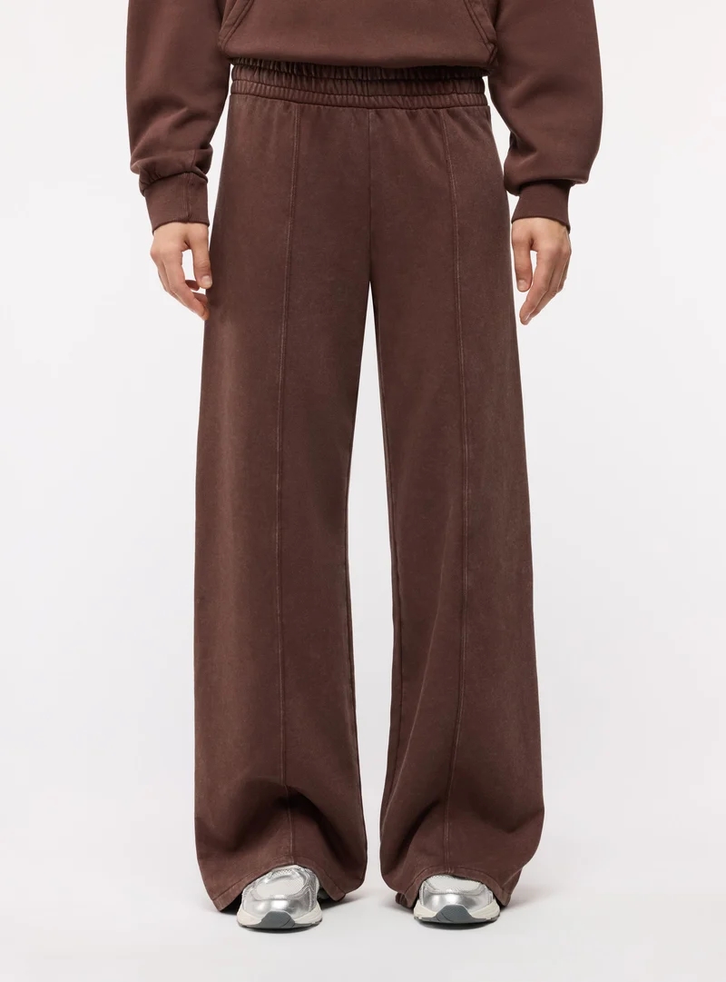 Pantaloni tuta wide leg a tinta unita