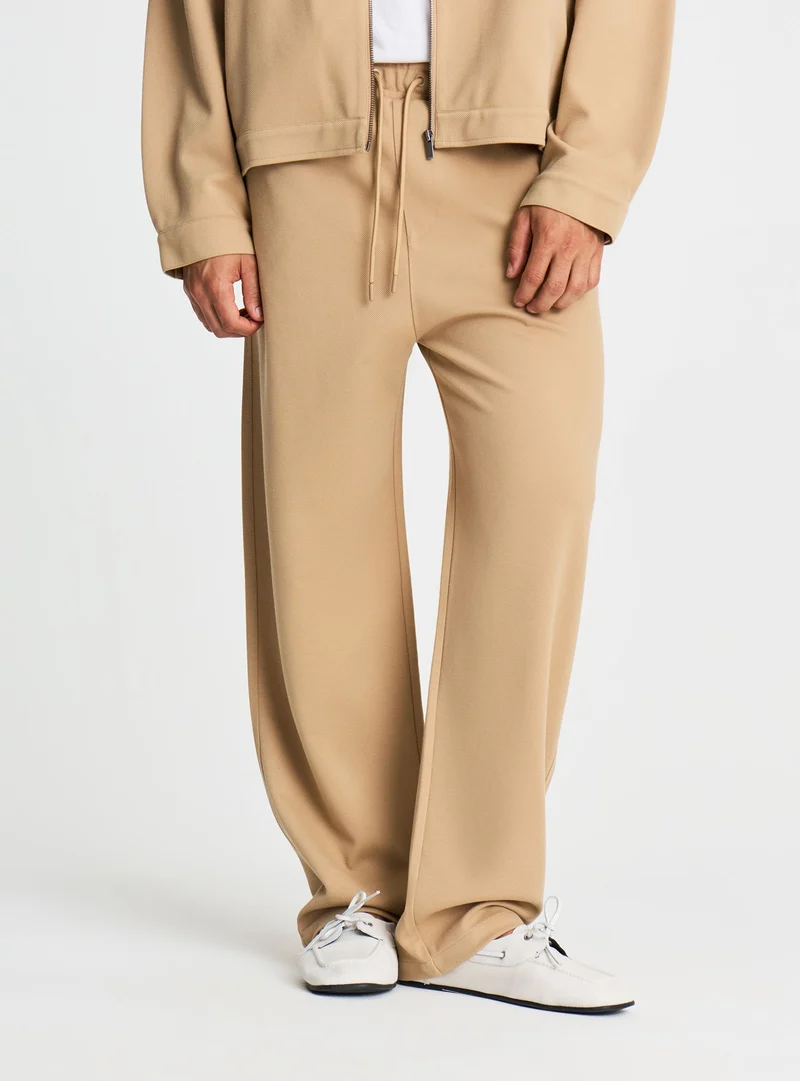 Pantaloni tuta wide leg a tinta unita