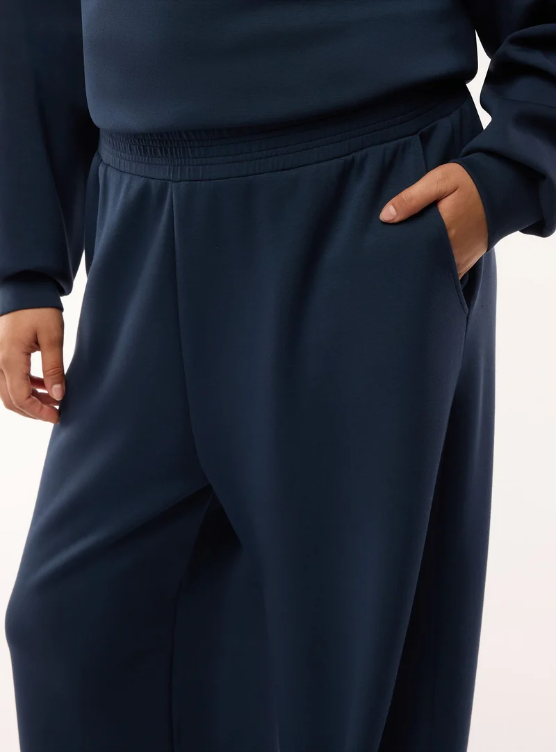 Pantaloni tuta wide leg a tinta unita
