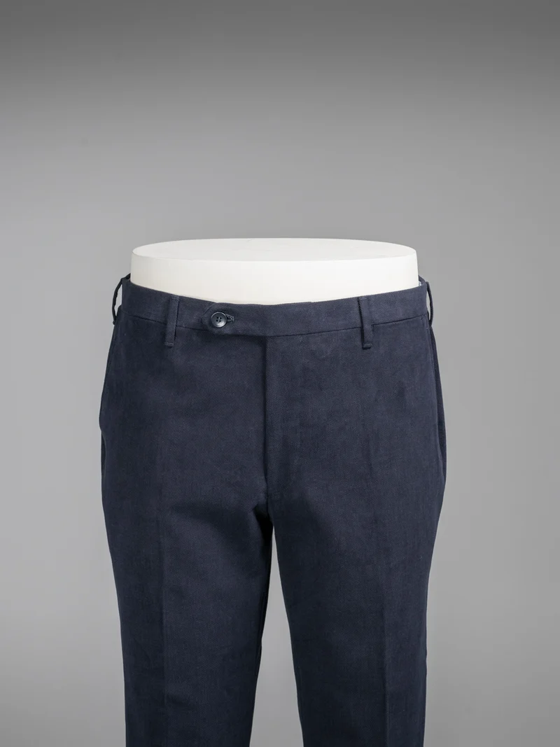 Dark blue pair of regular fit cotton trousers