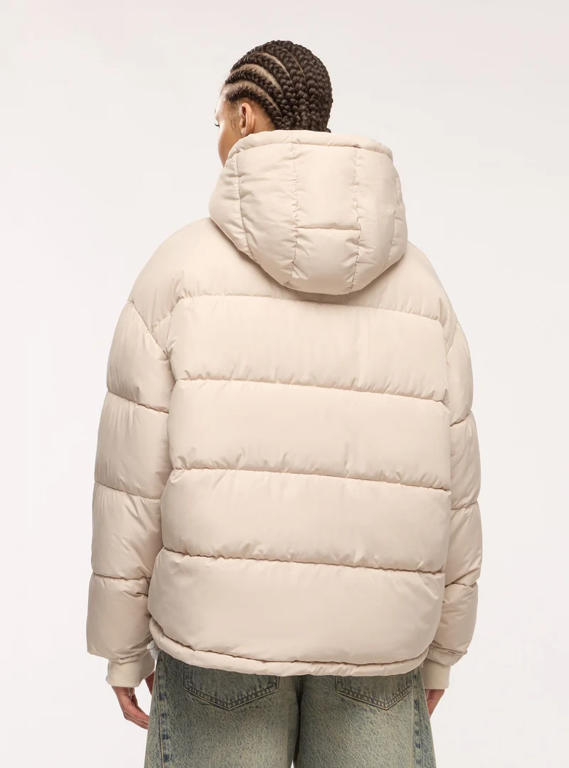 Giubbotto imbottito oversize con cappuccio