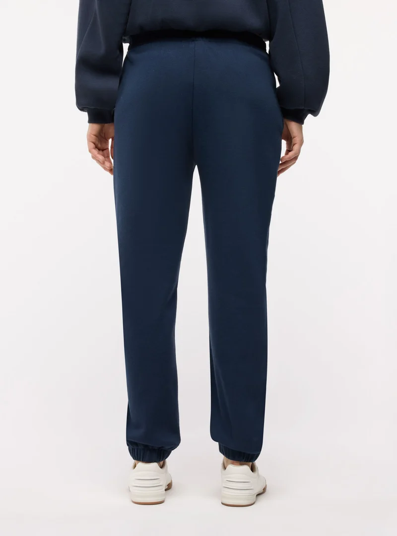 Pantaloni tuta lunghi con elastico