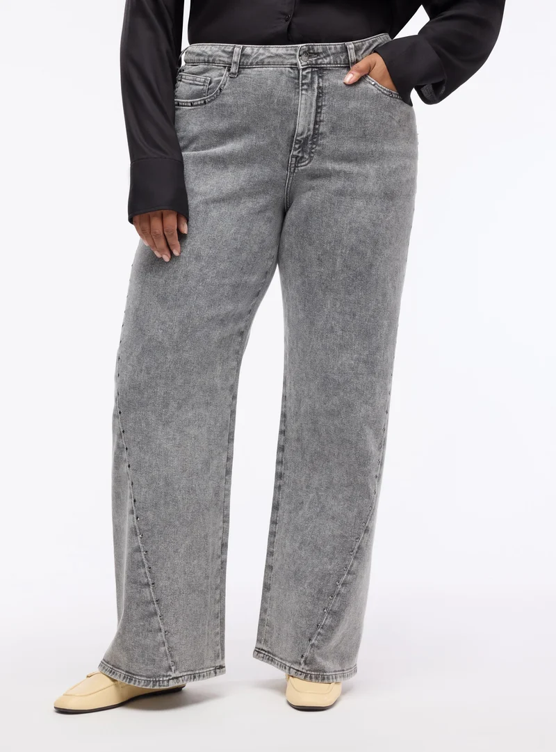 Jeans wide leg con borchie