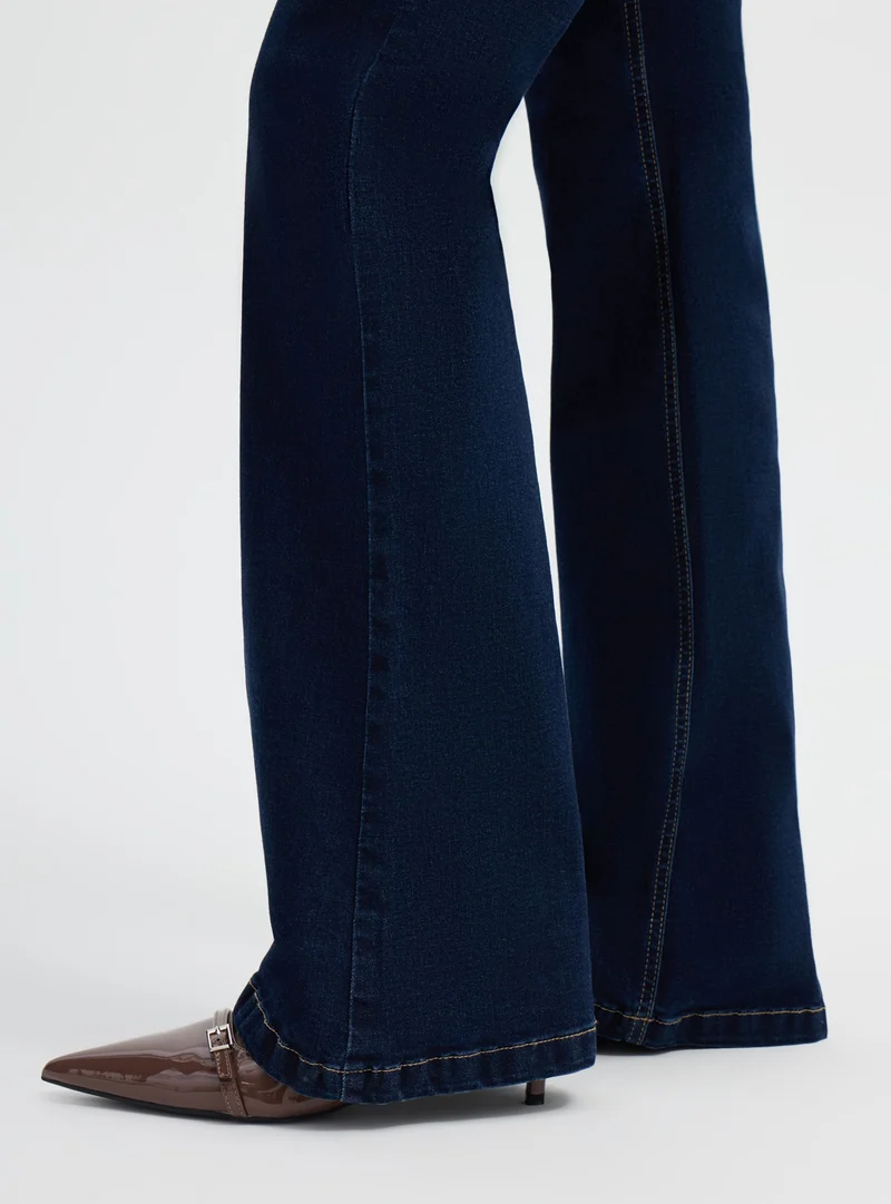 Jeans a zampa a vita alta tinta unita