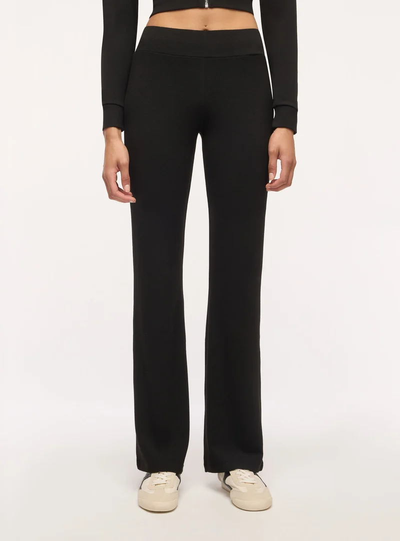 Leggings lunghi a zampa tinta unita