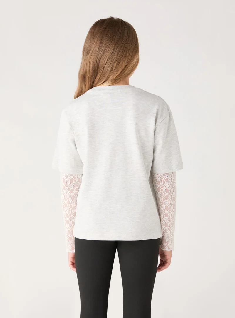 T-shirt a maniche lunghe con stampa e applicazioni