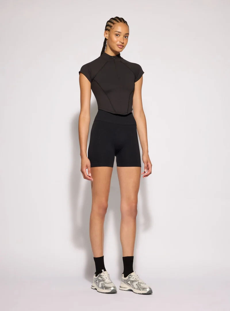 T-shirt sportiva con mezza zip a tinta unita
