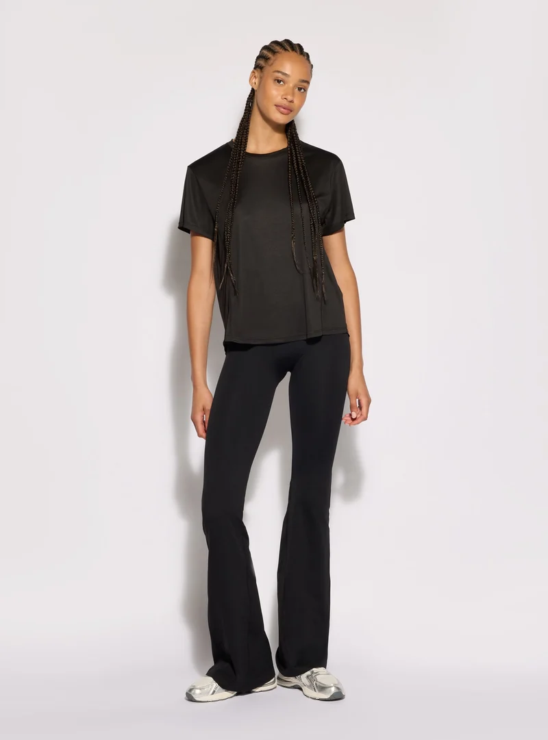 T-shirt sportiva over a tinta unita