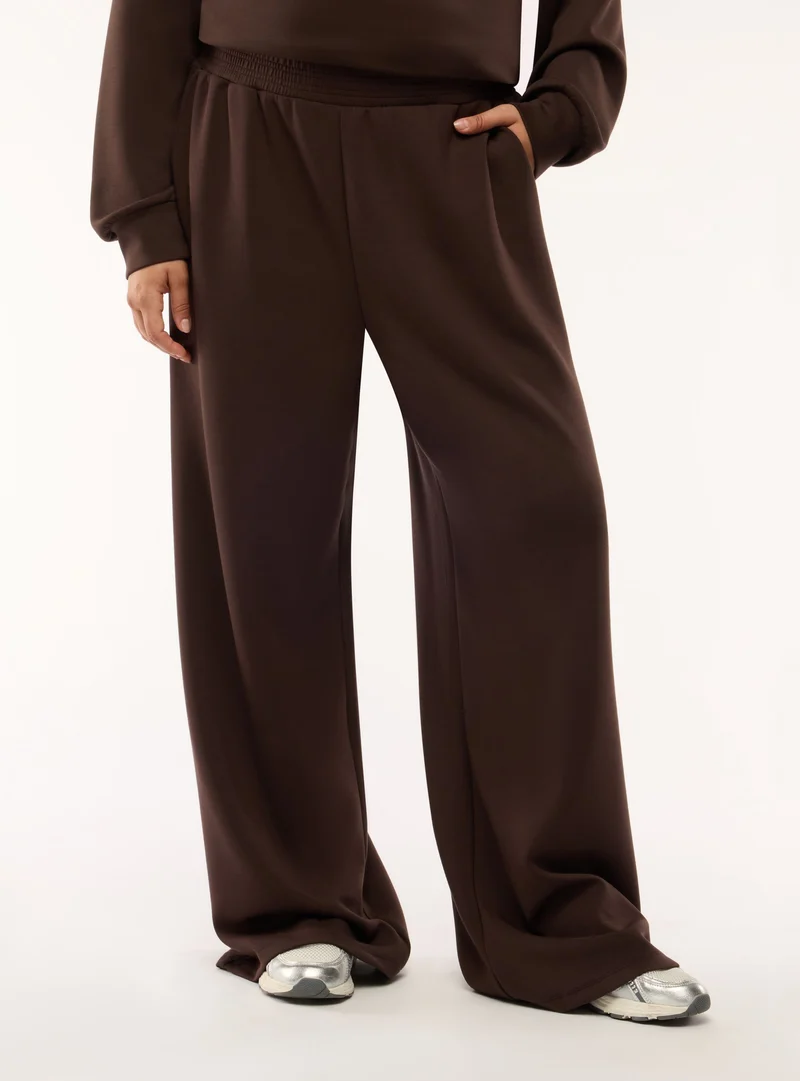 Pantaloni tuta wide leg a tinta unita