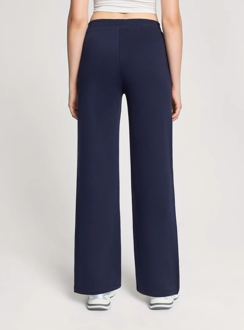 Pantaloni tuta wide leg tinta unita