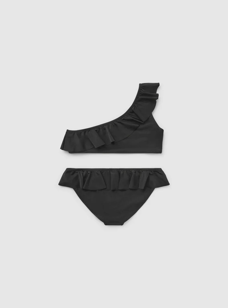 Bikini monospalla con balze tinta unita