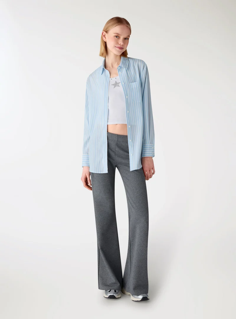 Pantaloni tuta flare vita bassa