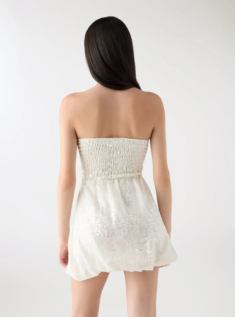 Vestito a fascia con gonna a palloncino e paillettes