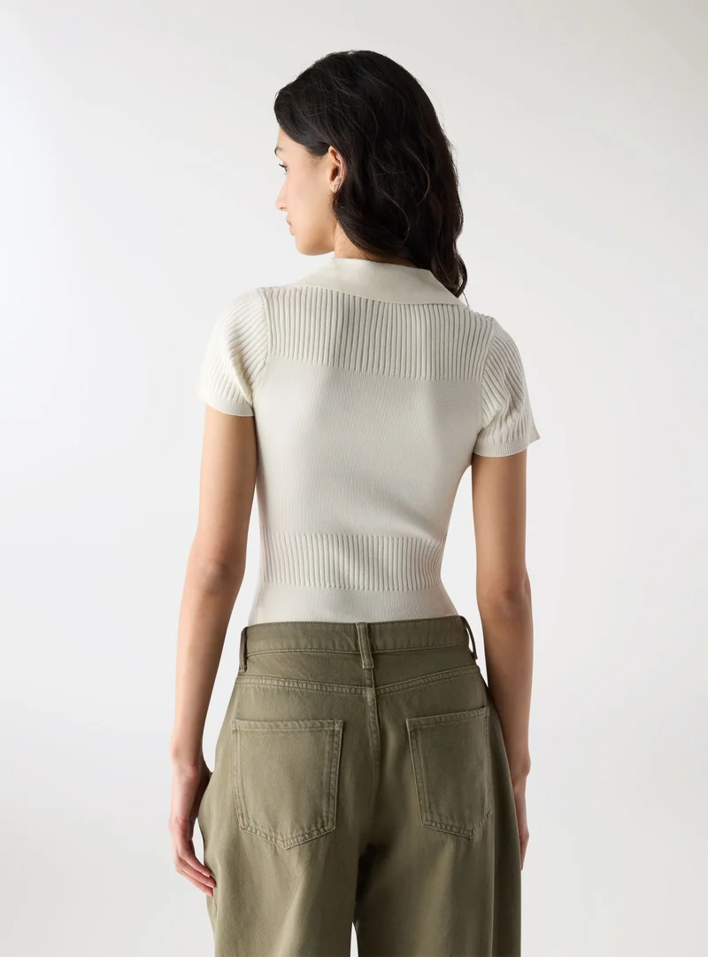 Body in maglia a tinta unita con colletto polo