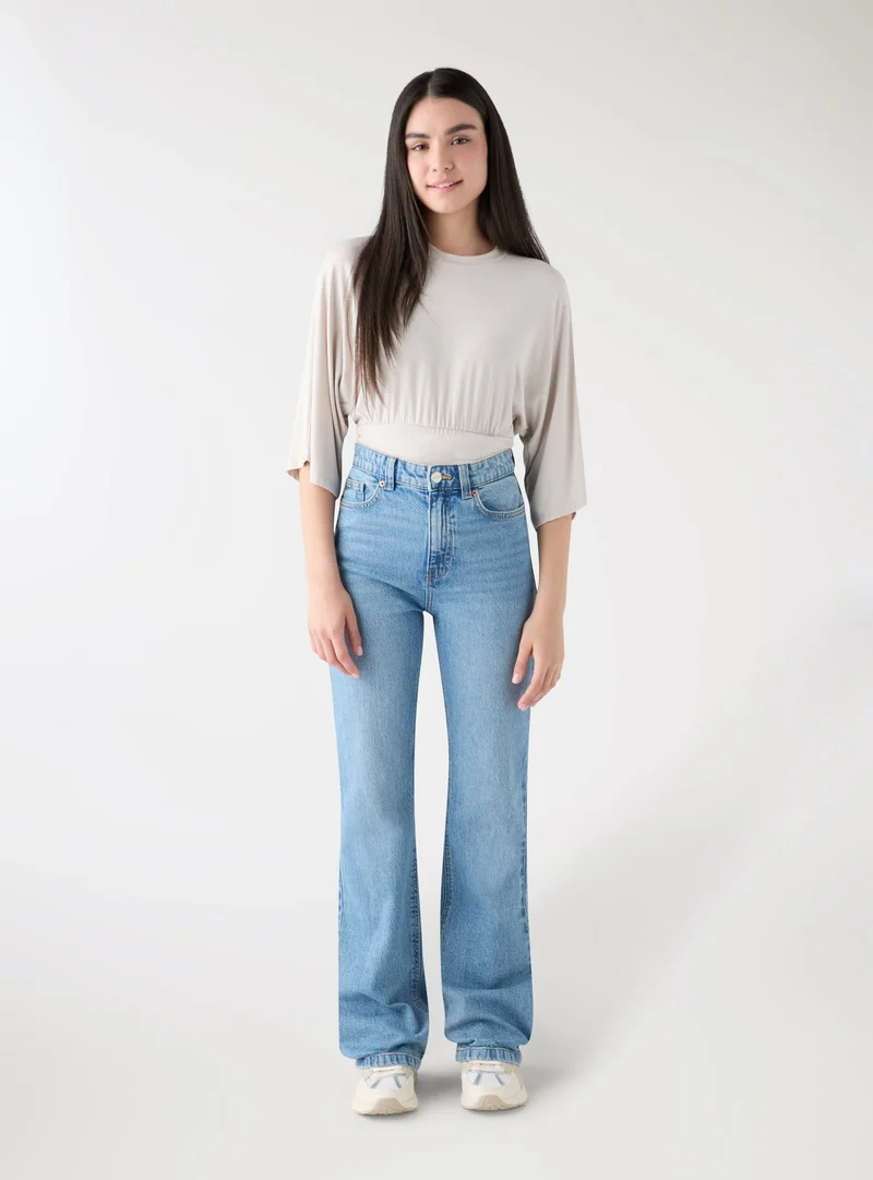 T-shirt over con vita arricciata effetto corsetto