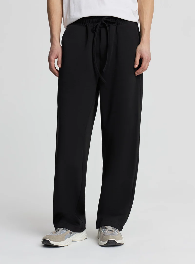 Pantaloni tuta relaxed a tinta unita