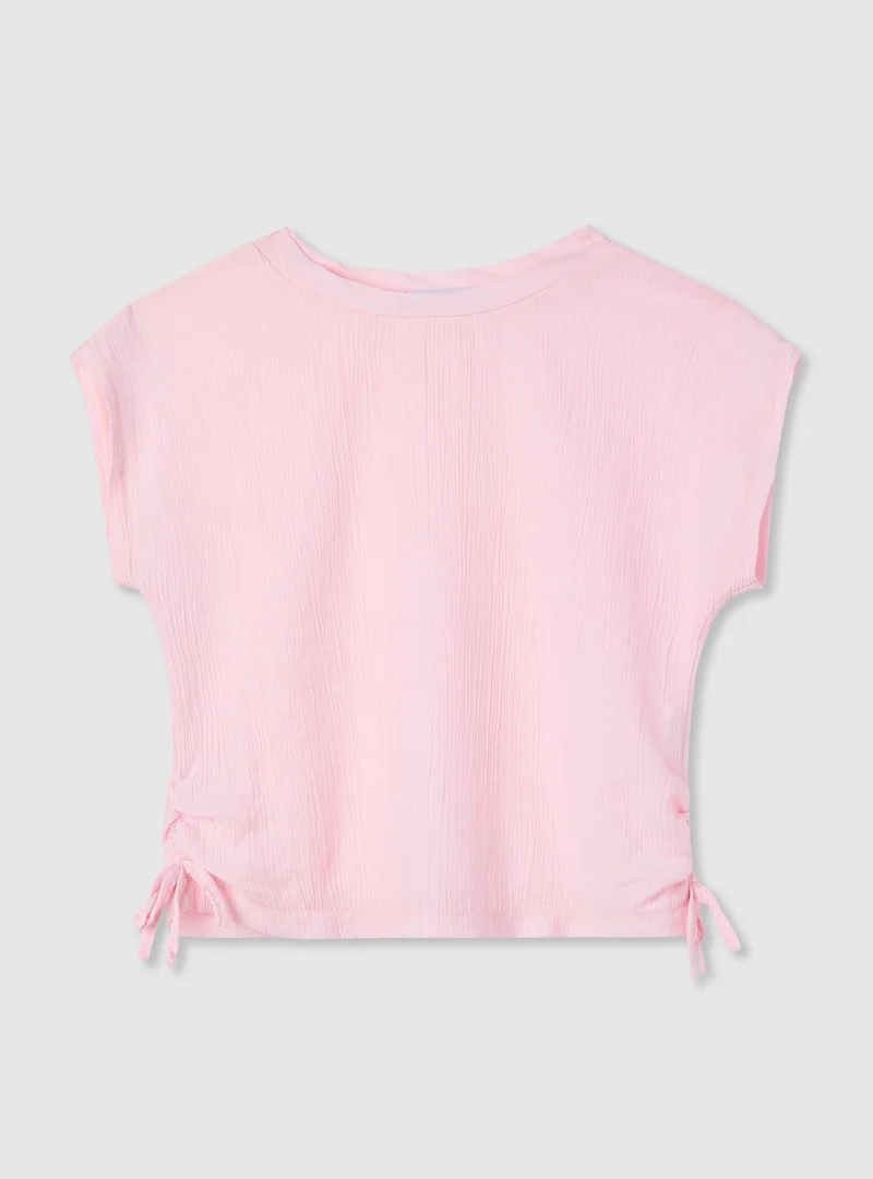 T-shirt a tinta unita goffrata con coulisse laterali