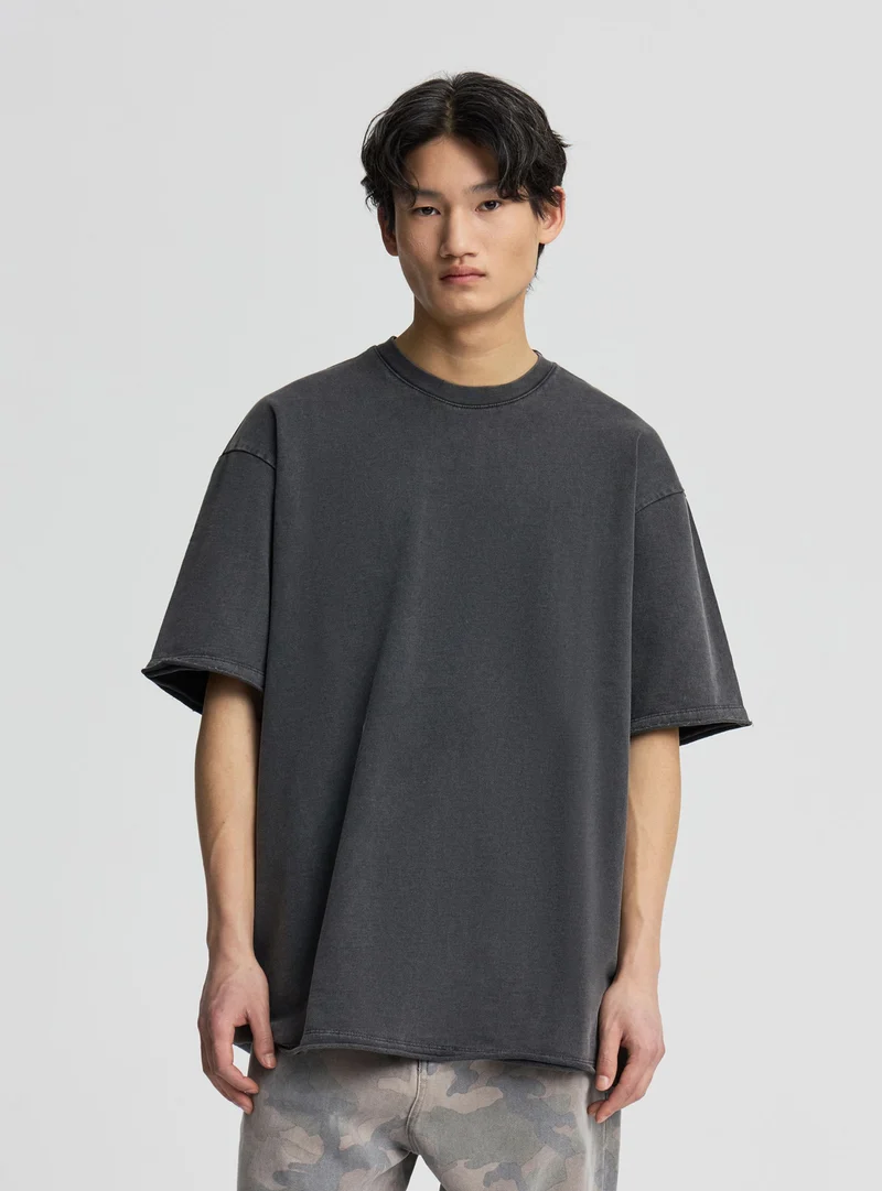 T-shirt boxy effetto acid wash a tinta unita