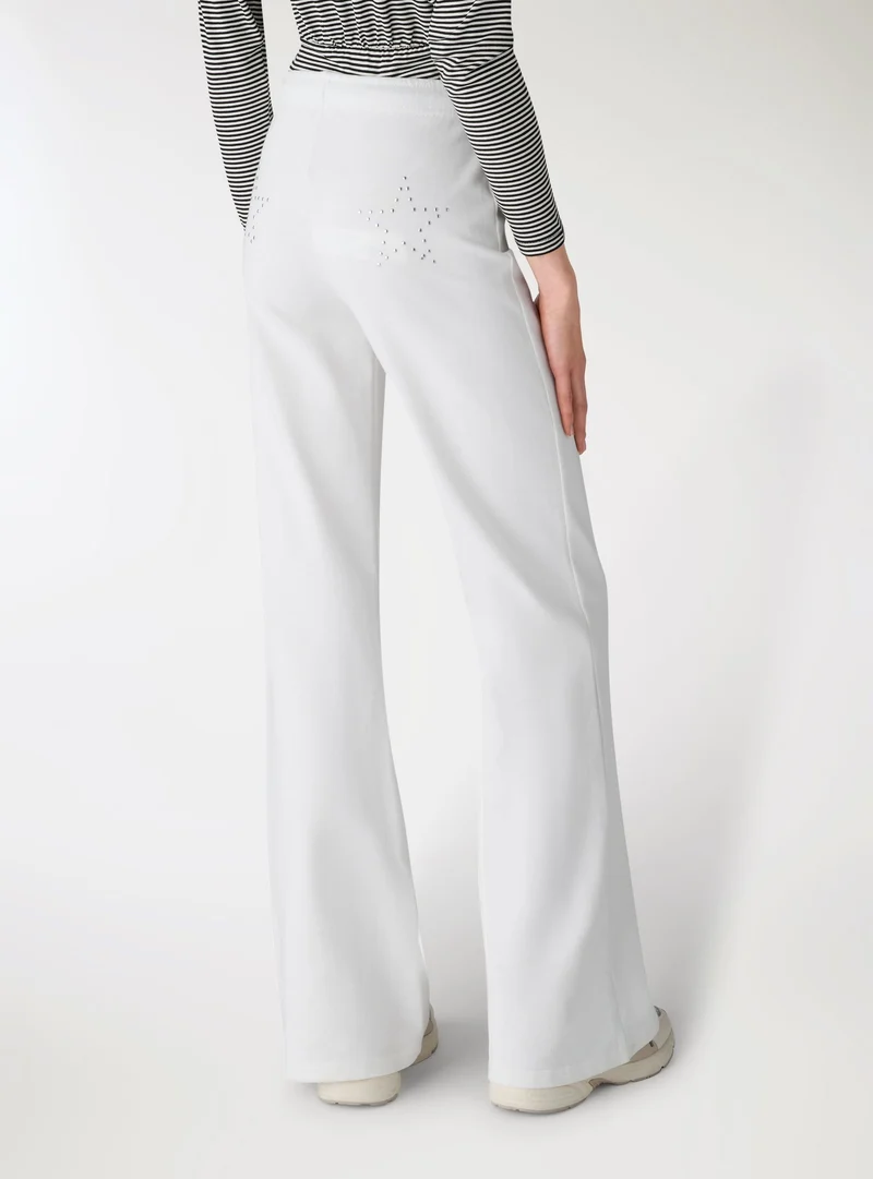 Pantaloni tuta flare vita bassa