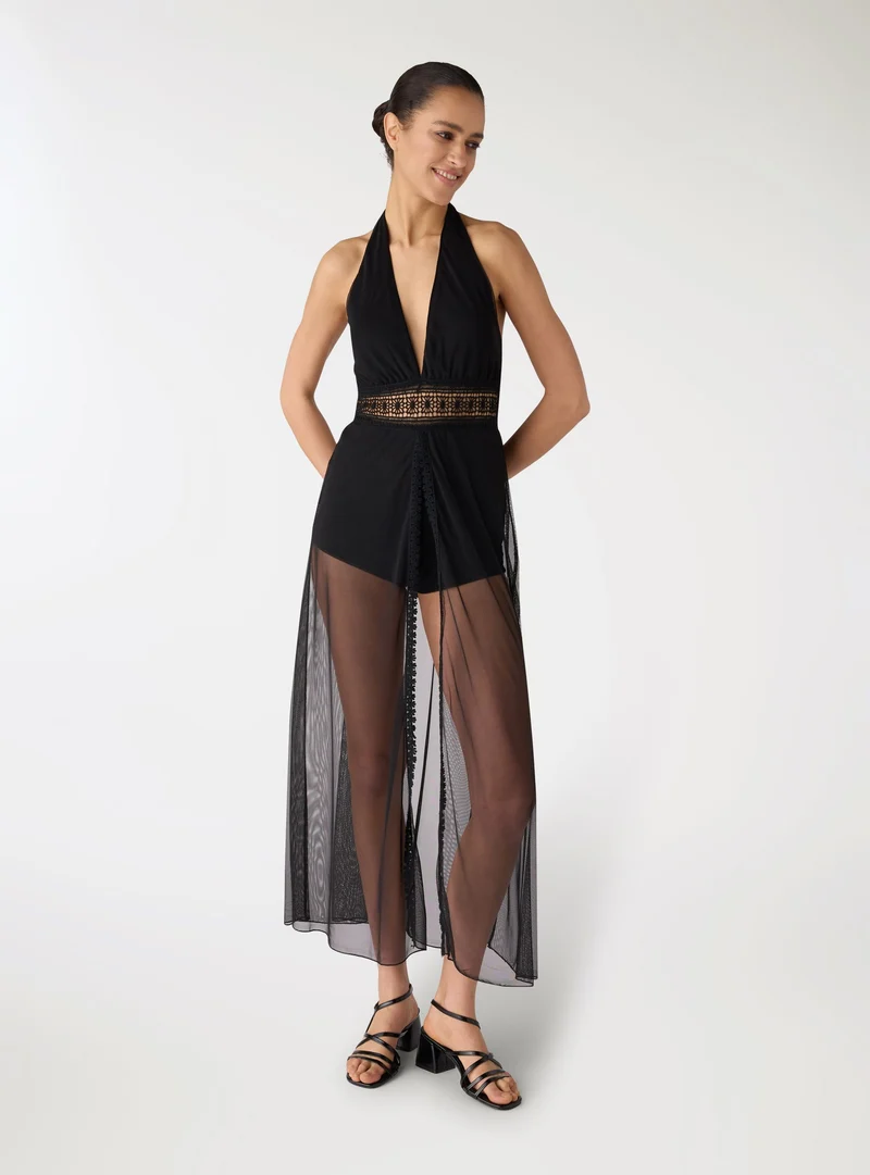 Vestito halterneck con inserto in pizzo e gonna trasparente