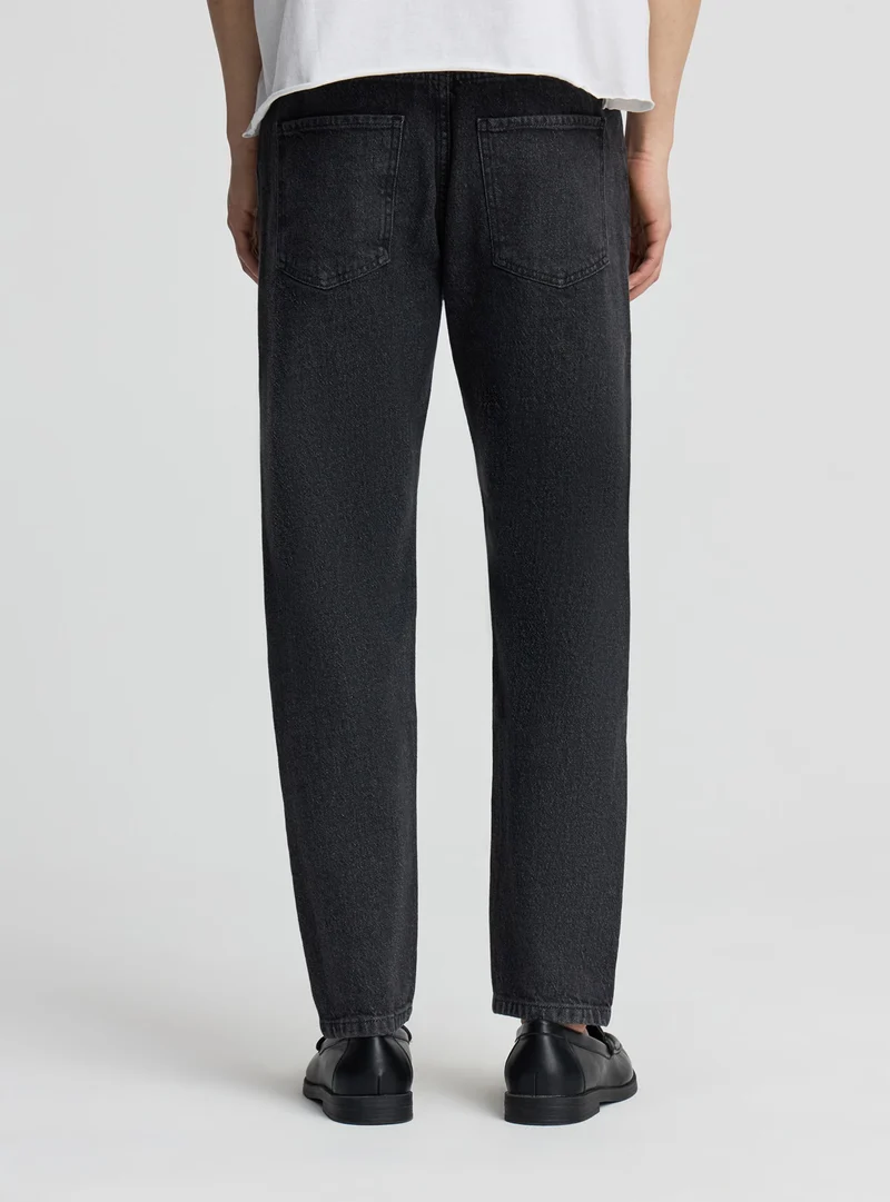 Jeans slim a tinta unita