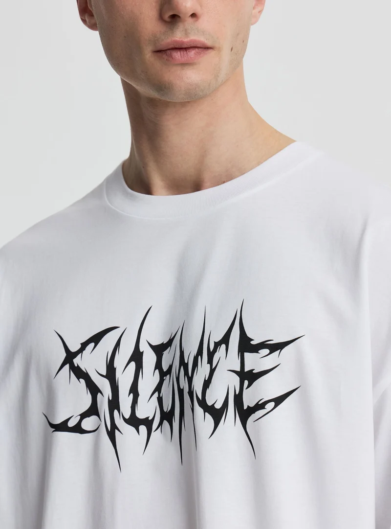 T-shirt over con stampa lettering