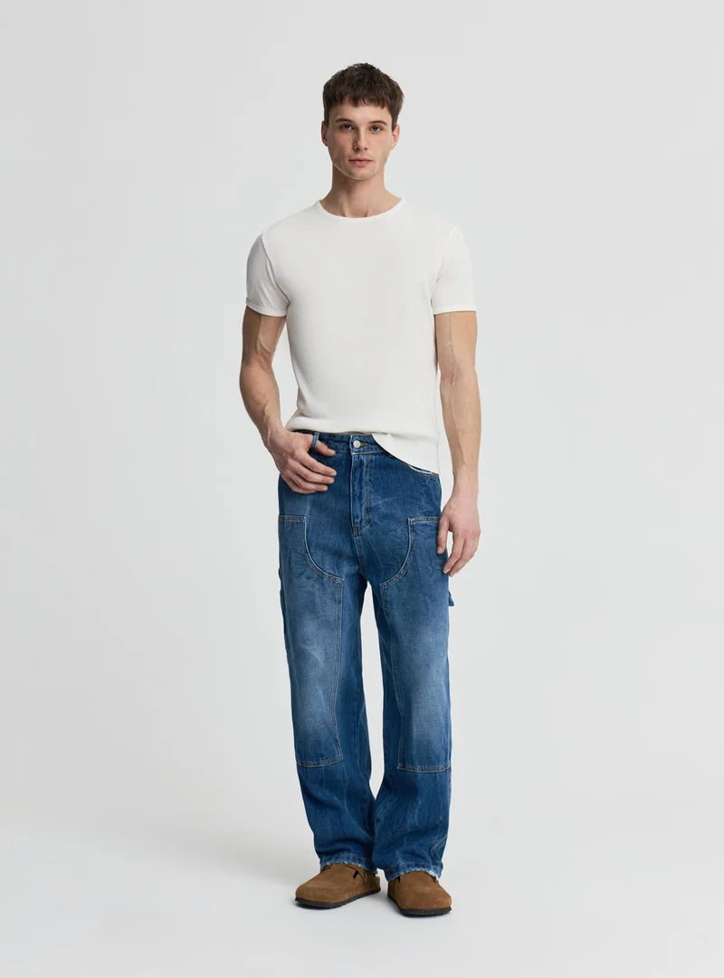 Jeans carpenter con doppia ginocchiera