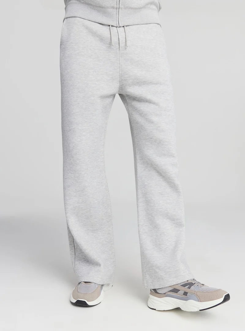Pantaloni tuta wide leg con coulisse