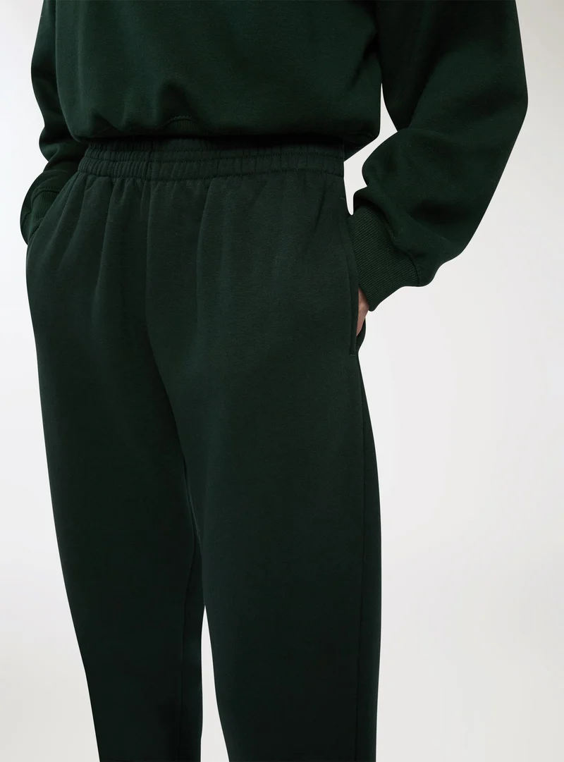 Pantaloni tuta vita alta con polsini