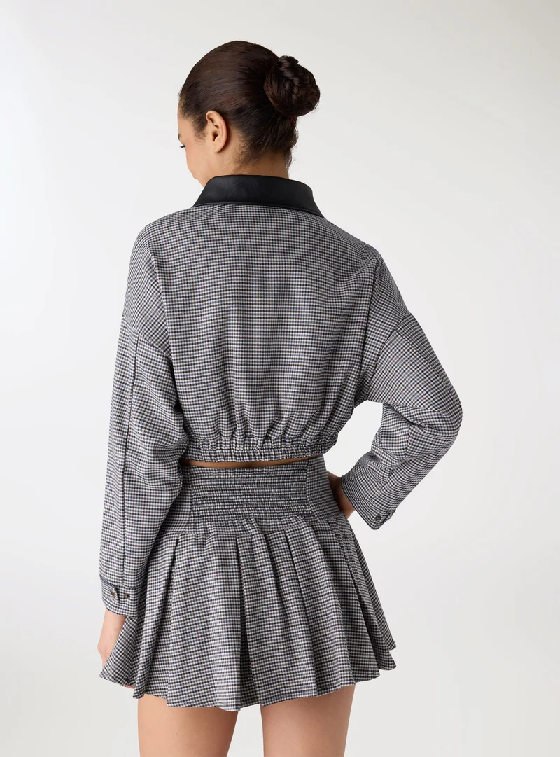 Bomber crop con fantasia a quadretti