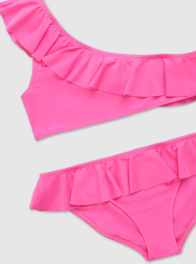 Bikini monospalla con balze tinta unita