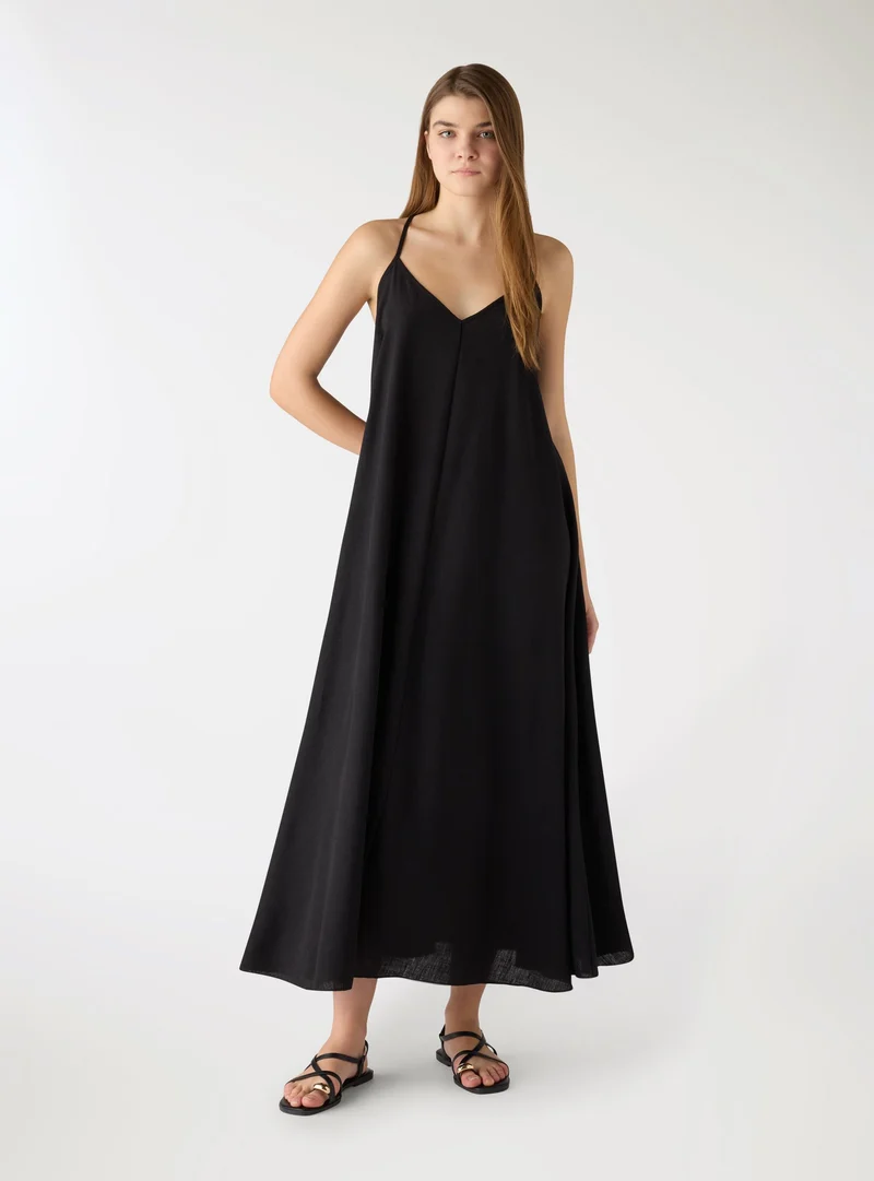 Vestito lungo a tinta unita con spalline incrociate