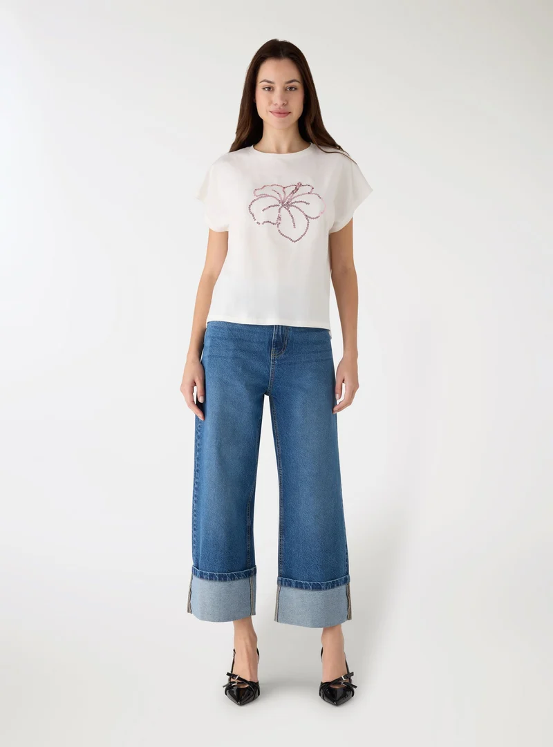 Jeans wide leg con risvolto