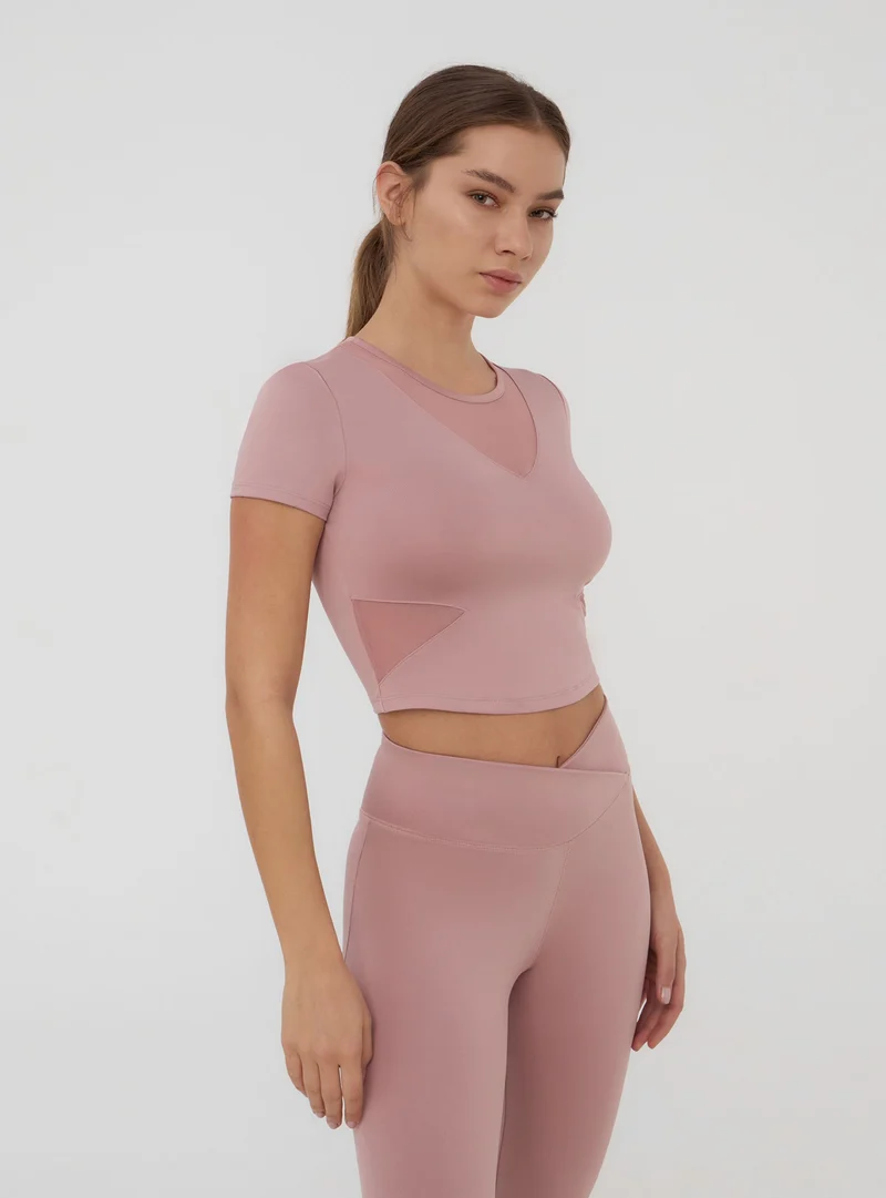T-shirt crop in microfibra con trasparenze