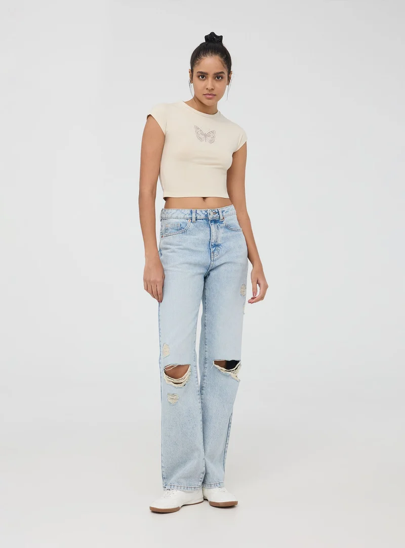 T-shirt crop con stampa farfalla e applicazioni