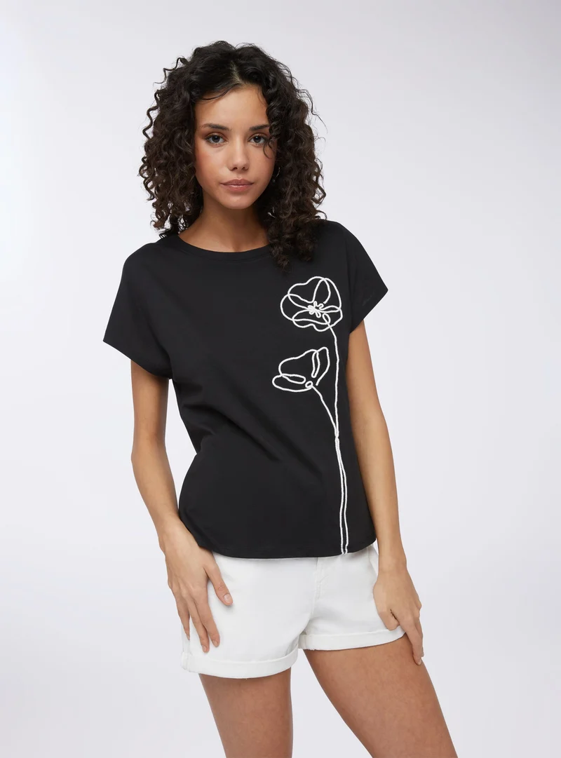 T-shirt ampia con applicazione fiori stilizzati