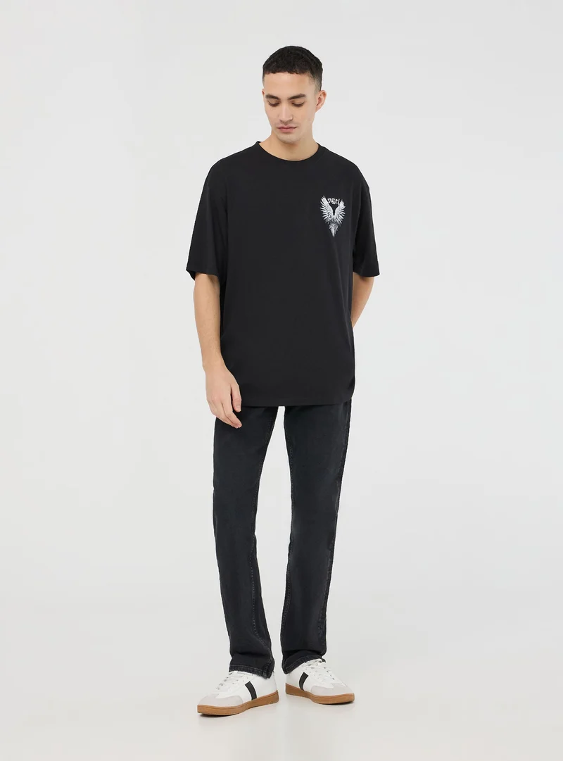 T-shirt over con stampa ali fronte/retro