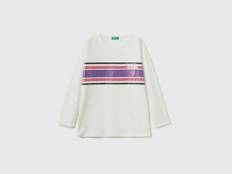 T-shirt lunga con stampa glitterata