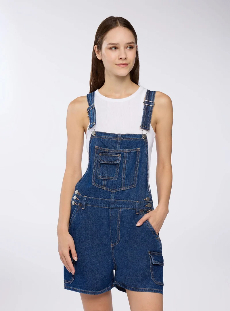 Salopette corta in denim