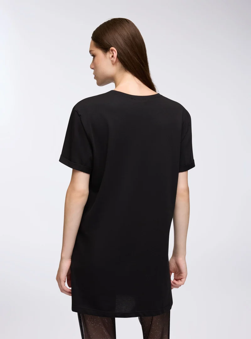 T-shirt maxi over a tinta unita