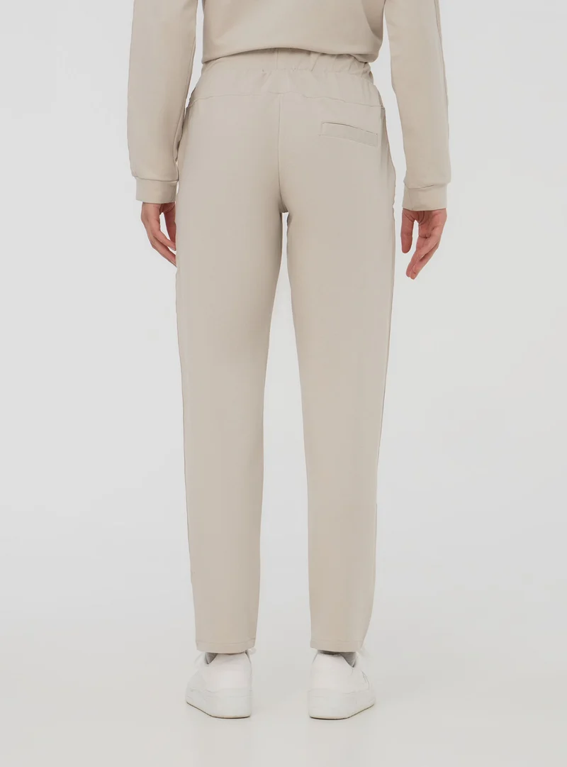 Pantaloni skinny effetto raso con banda laterale