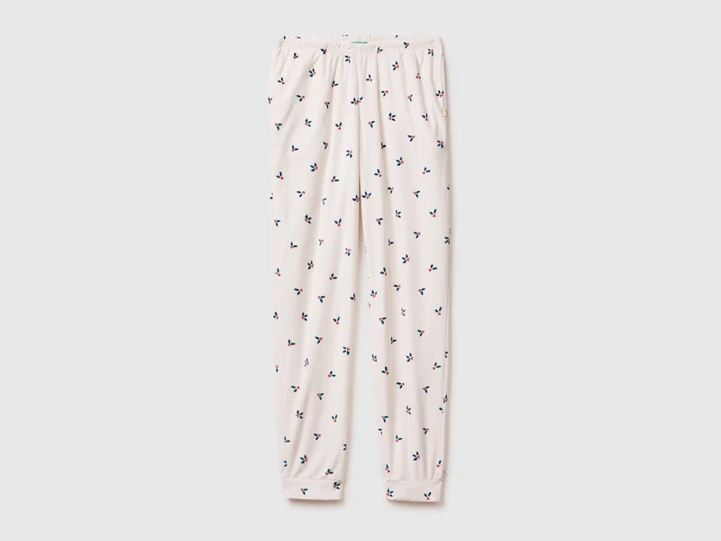 Pantaloni natalizi con stampa agrifogli