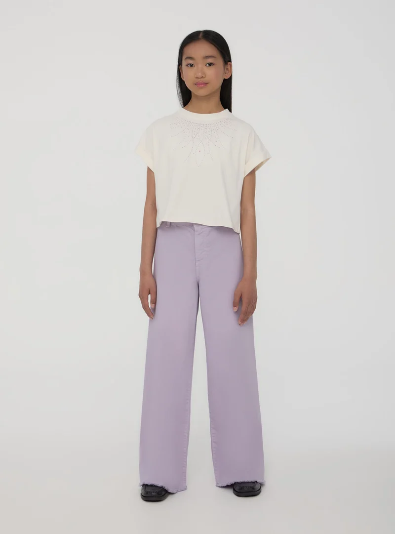 T-shirt crop con borchie