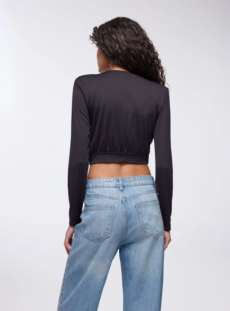 Maglia con scollo a V e fibbia