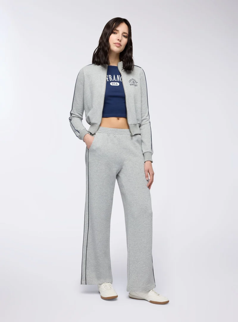 Pantaloni tuta wide leg con banda laterale