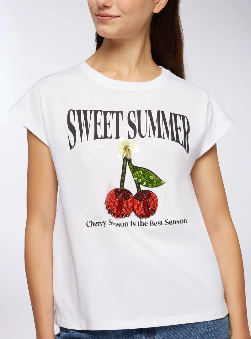 T-shirt con applicazioni e stampa frutta
